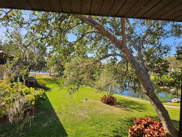 a view of a porch and a yard