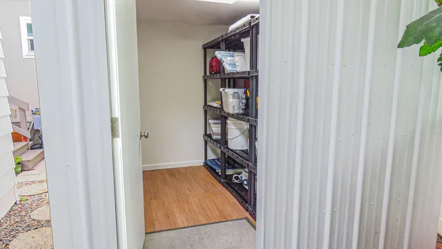 a large kitchen with stainless steel appliances granite countertop a stove a sink a microwave and a refrigerator