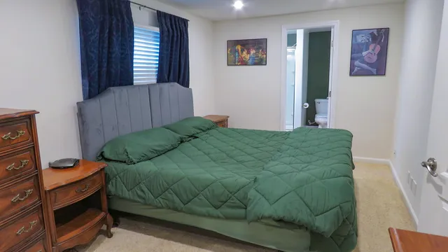 a livingroom with workspace and a couch