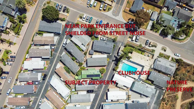 an aerial view of residential houses and outdoor space