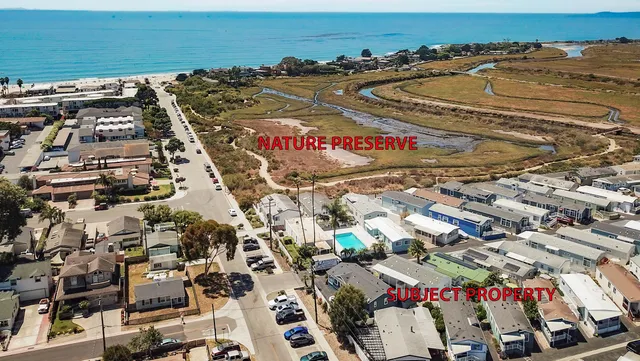 a view of a city with mountains in the background