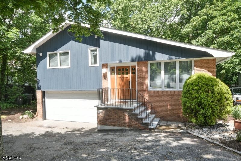 511 Scotland Road South Orange, NJ 07079 - Photo 2 of 26 a front view of a house with a yard and garage
