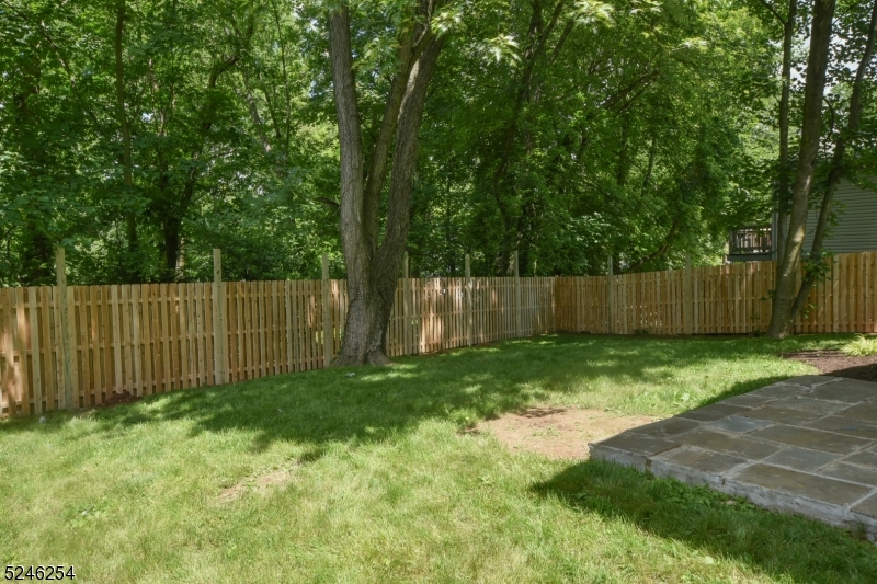 511 Scotland Road South Orange, NJ 07079 - Photo 23 of 26 a view of a backyard with large trees and wooden fence