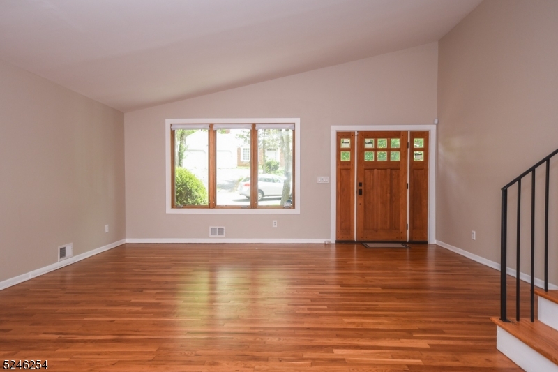 511 Scotland Road South Orange, NJ 07079 - Photo 3 of 26 a view of an empty room with wooden floor and a window