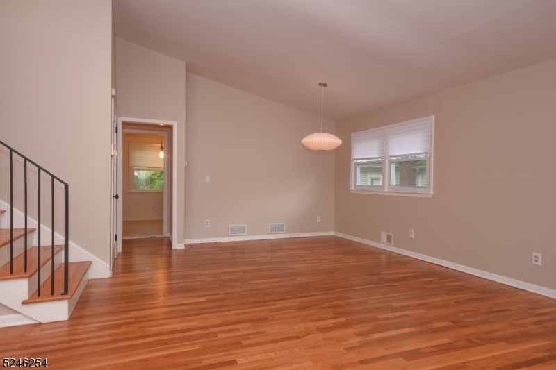 511 Scotland Road South Orange, NJ 07079 - Photo 4 of 26 a view of an empty room with wooden floor and a window