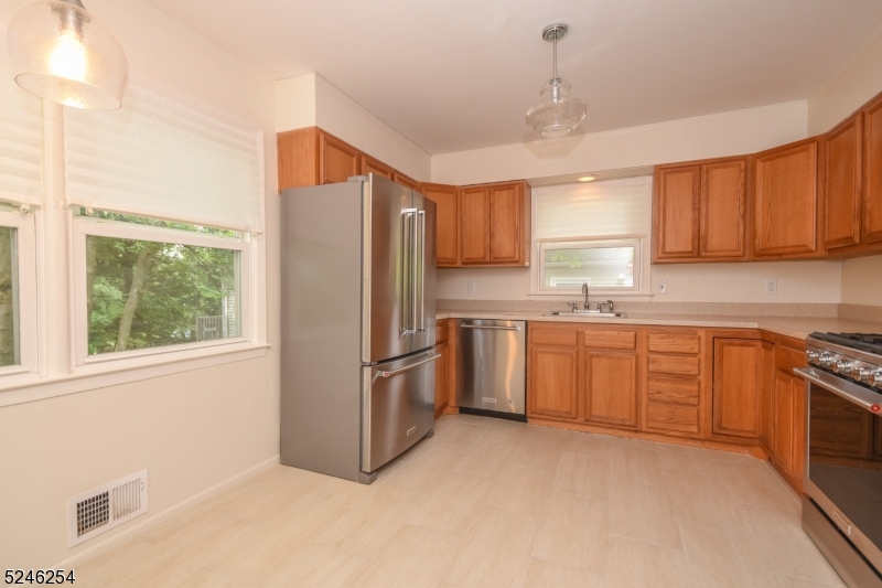 511 Scotland Road South Orange, NJ 07079 - Photo 7 of 26 a kitchen with stainless steel appliances granite countertop a refrigerator sink and cabinets