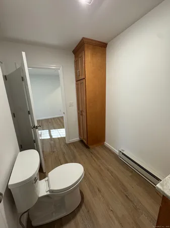 a bathroom with a toilet mirror
