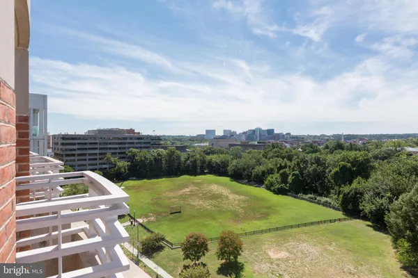 a view of a swimming pool with a yard