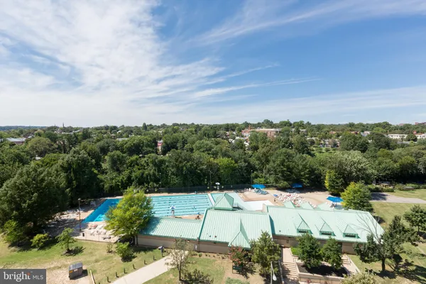 a view of a swimming pool with a yard