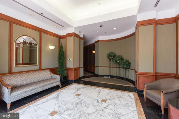 a spacious bedroom with a bed and a dresser