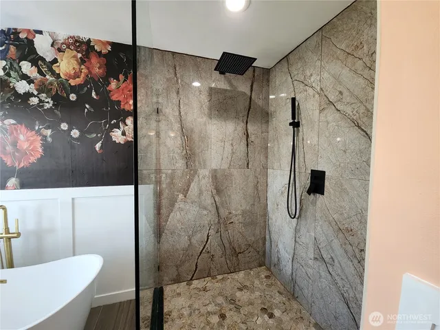 a bathroom with a shower and a toilet