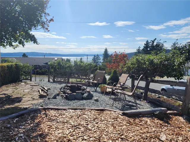 a view of a lake with outdoor seating