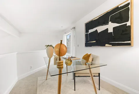 a bathroom with a shower curtain and a sink