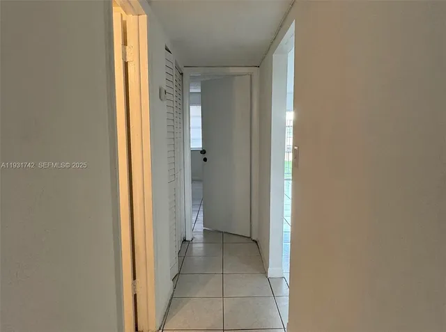 a view of a bathroom from a hallway