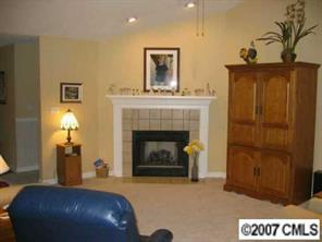 320 Jim Parker Road Monroe, NC 28110 - Photo 2 of 8 a living room with furniture and a fireplace