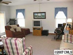 320 Jim Parker Road Monroe, NC 28110 - Photo 3 of 8 a living room with furniture fireplace and a flat screen tv
