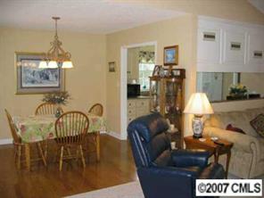 320 Jim Parker Road Monroe, NC 28110 - Photo 4 of 8 a living room with furniture and chandelier