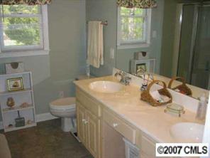 320 Jim Parker Road Monroe, NC 28110 - Photo 6 of 8 a bathroom with a sink a toilet and a window