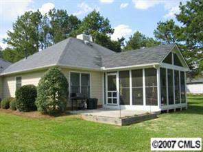 320 Jim Parker Road Monroe, NC 28110 - Photo 8 of 8 a view of a house with a yard and a garden