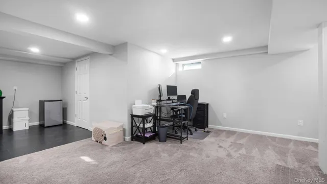 a view of a workspace with furniture and a livingroom