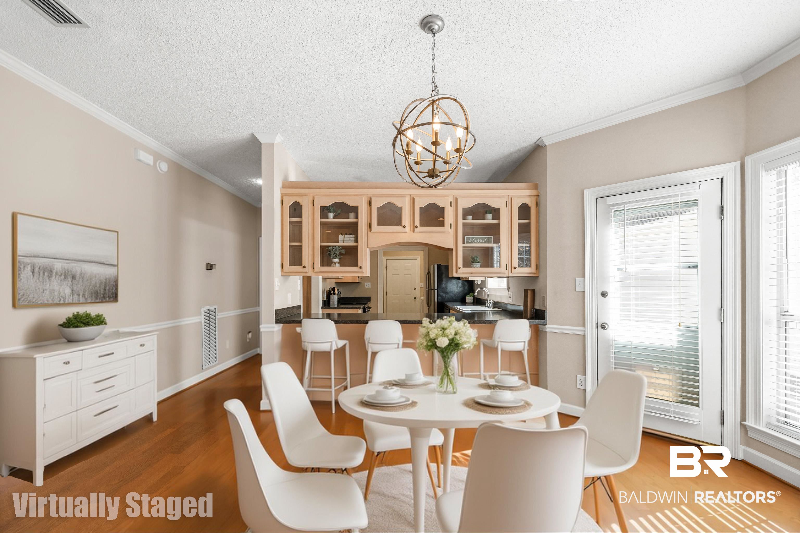 27 Cottage Drive Fairhope, AL 36532 - Photo 8 of 33 Virtually staged Dining area featuring a textured ceiling, light wood-style floors, ornamental molding, and a chandelier