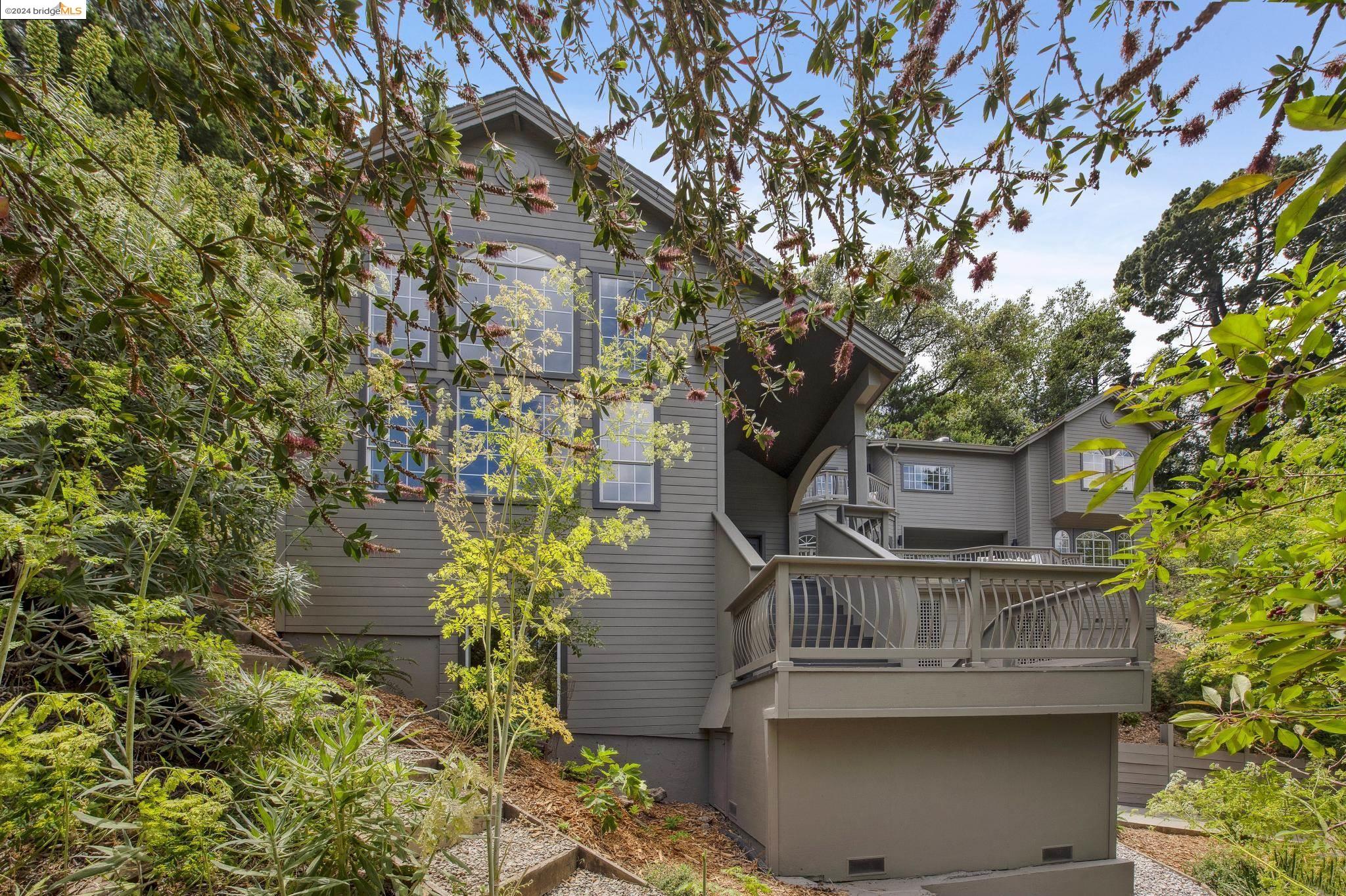 6512 Girvin Drive Oakland, CA 94611 - Photo 1 of 1 front view of a house with a tree