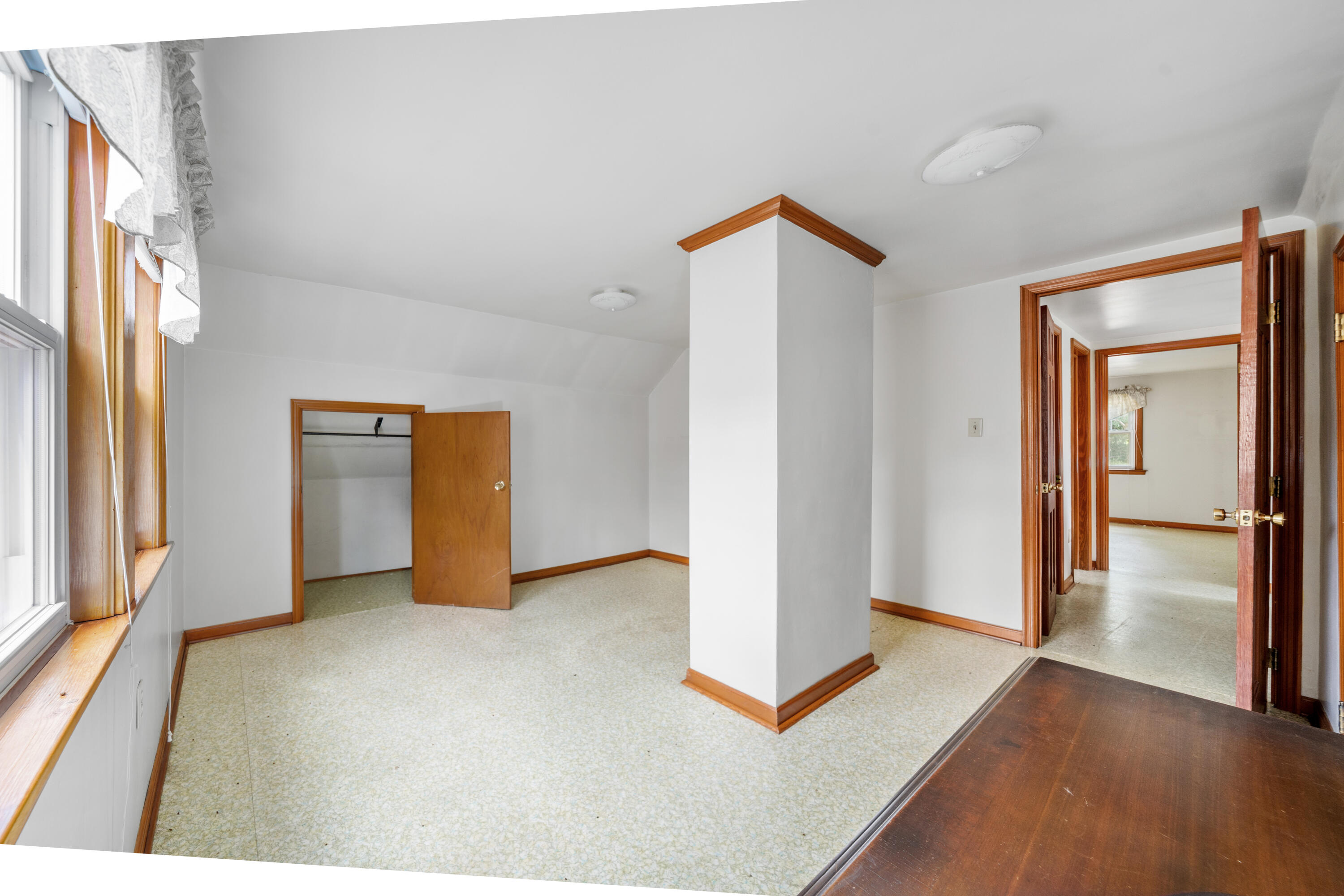 77 Mountain Pass Road Blue Ridge, VA 24064 - Photo 16 of 25 a view of an empty room with window and wooden floor