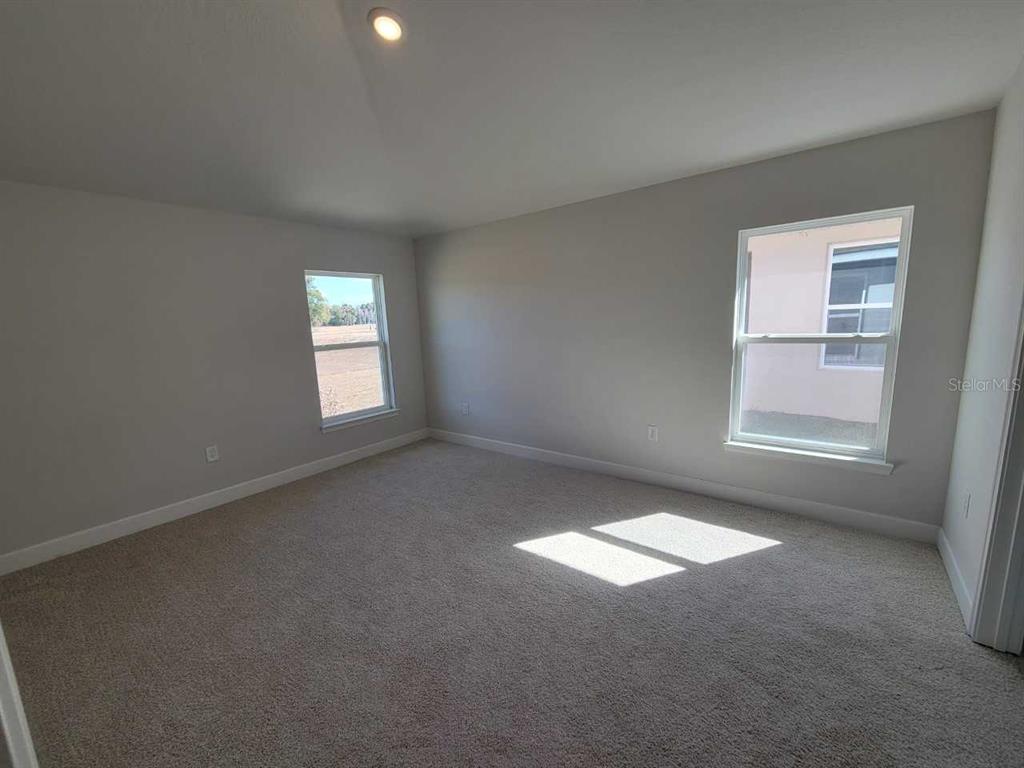 4465 Southwest 91st Ln Road Ocala, FL 34476 - Photo 12 of 42 a view of an empty room and window