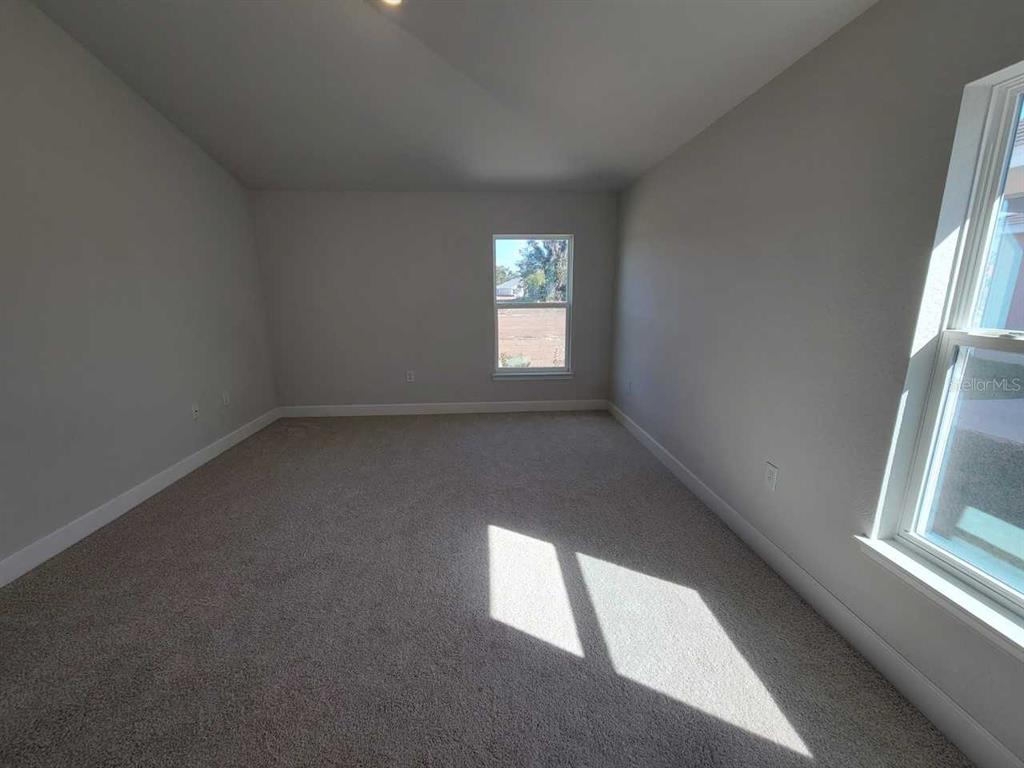 4465 Southwest 91st Ln Road Ocala, FL 34476 - Photo 13 of 42 an empty room with a window