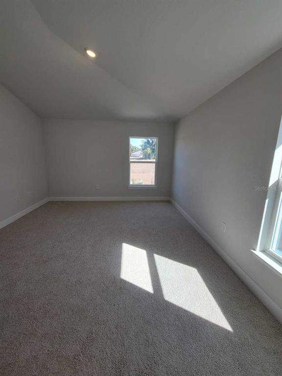 4465 Southwest 91st Ln Road Ocala, FL 34476 - Photo 14 of 42 an empty room with windows