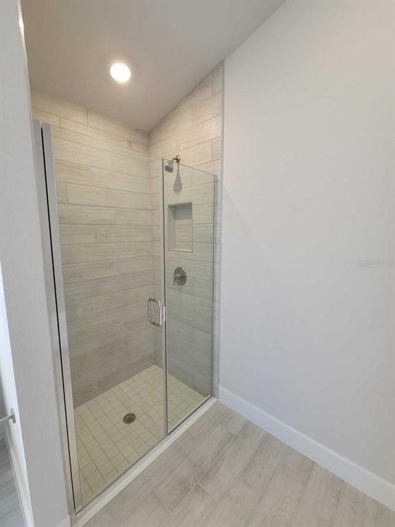 4465 Southwest 91st Ln Road Ocala, FL 34476 - Photo 16 of 42 a bathroom with a shower and a sink