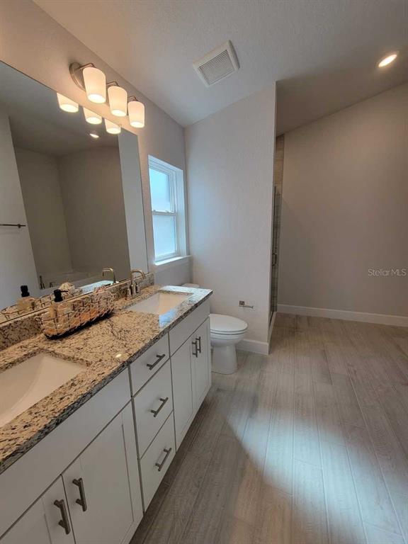 4465 Southwest 91st Ln Road Ocala, FL 34476 - Photo 17 of 42 a bathroom with a granite countertop sink and a mirror