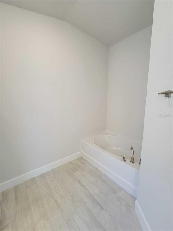 4465 Southwest 91st Ln Road Ocala, FL 34476 - Photo 21 of 42 a bathroom with a bathtub