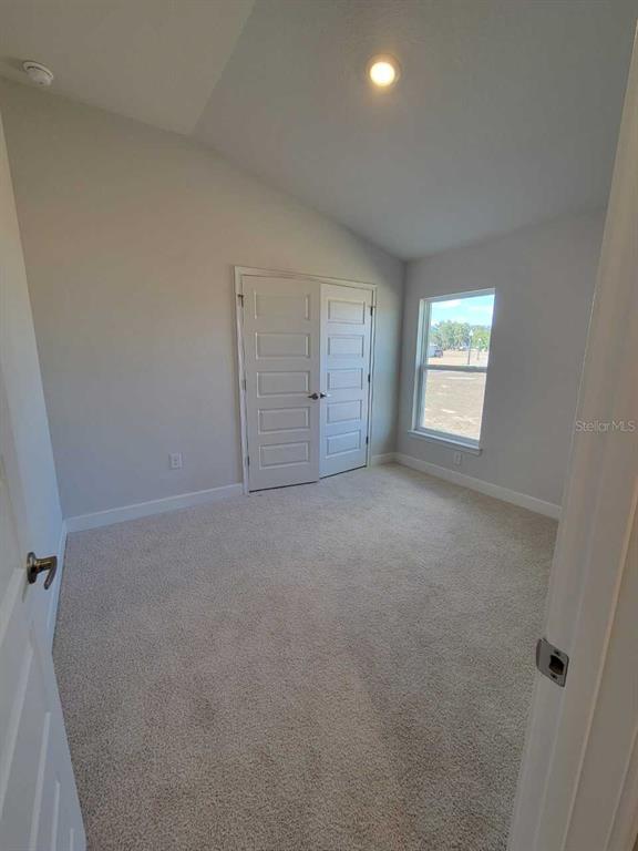 4465 Southwest 91st Ln Road Ocala, FL 34476 - Photo 24 of 42 an empty room with windows