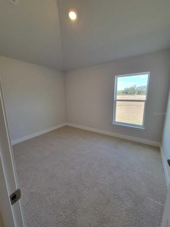 4465 Southwest 91st Ln Road Ocala, FL 34476 - Photo 25 of 42 an empty room with a window