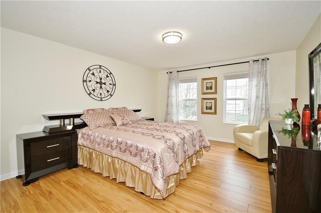 1076 Rural Ridge Drive Cheswick, PA 15024 - Photo 26 of 37 a bedroom with a bed and a couch