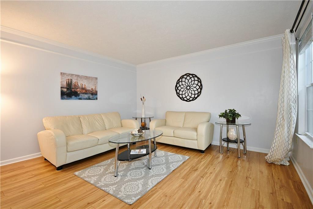 1076 Rural Ridge Drive Cheswick, PA 15024 - Photo 7 of 37 a living room with furniture and a wooden floor