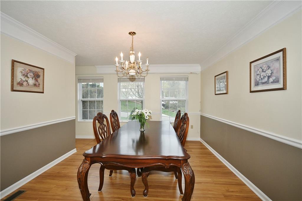 1076 Rural Ridge Drive Cheswick, PA 15024 - Photo 8 of 37 a view of a dining room with furniture and chandelier