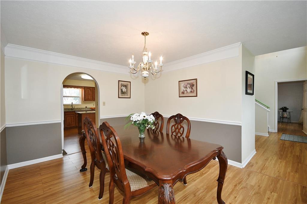 1076 Rural Ridge Drive Cheswick, PA 15024 - Photo 9 of 37 a view of a dining room with furniture and wooden floor