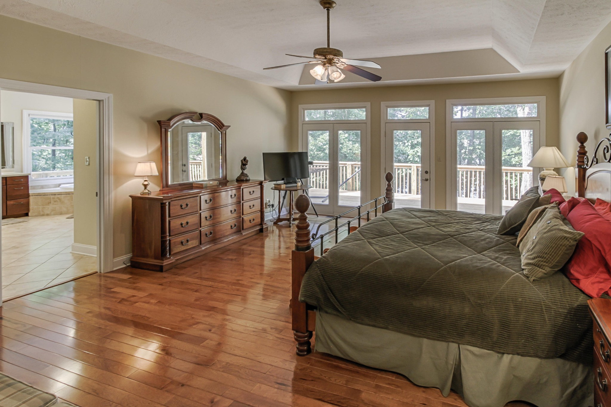 600 Baye Road Rutledge, TN 37861 - Photo 15 of 34 a spacious bedroom with a bed a chandelier and windows