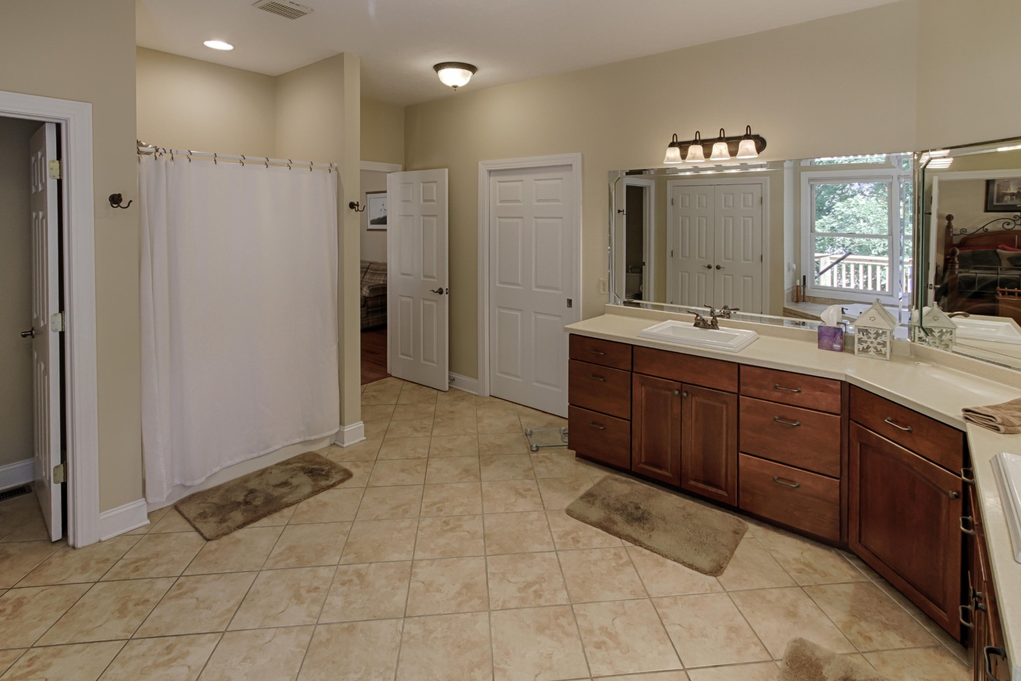 600 Baye Road Rutledge, TN 37861 - Photo 17 of 34 a spacious bathroom with a mirror sink and shower
