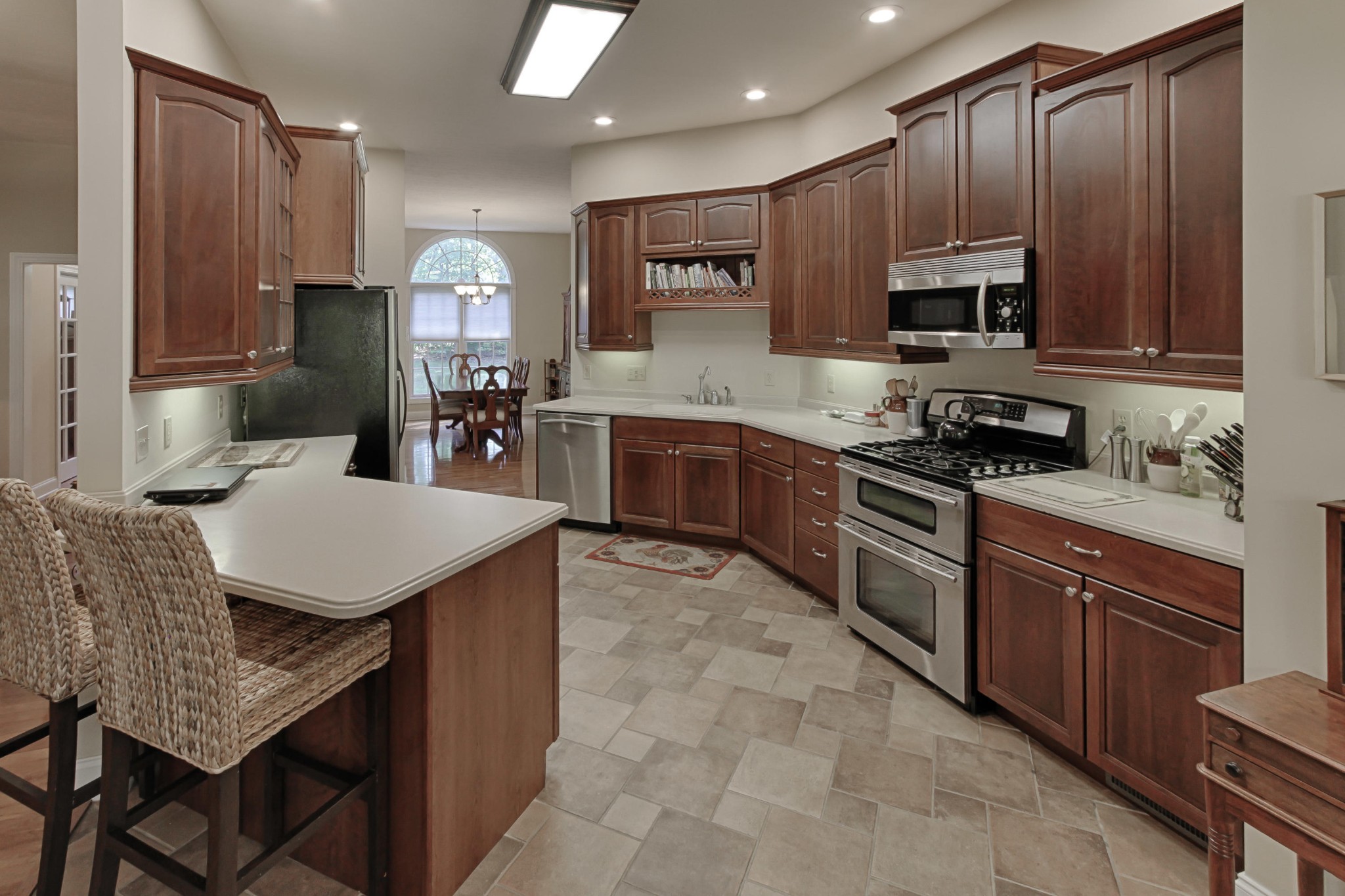 600 Baye Road Rutledge, TN 37861 - Photo 10 of 34 a kitchen with stainless steel appliances granite countertop a stove a sink a microwave a refrigerator and cabinets