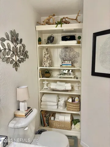 a shelf with books and knick knacks on it
