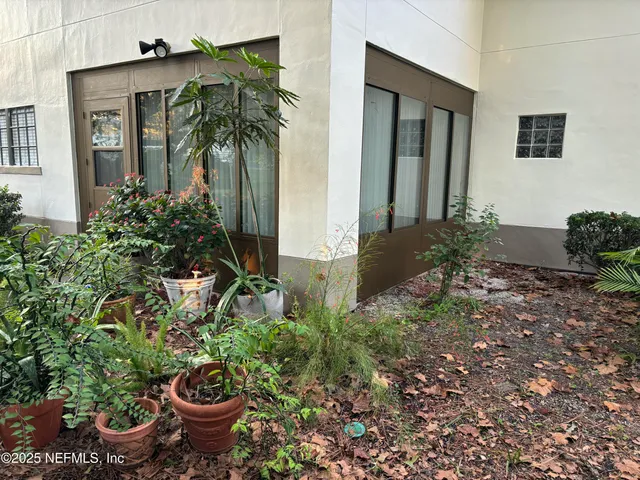 a view of a backyard of the house