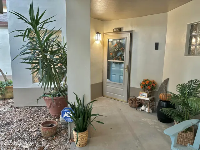 a vase of flowers sitting on a table field