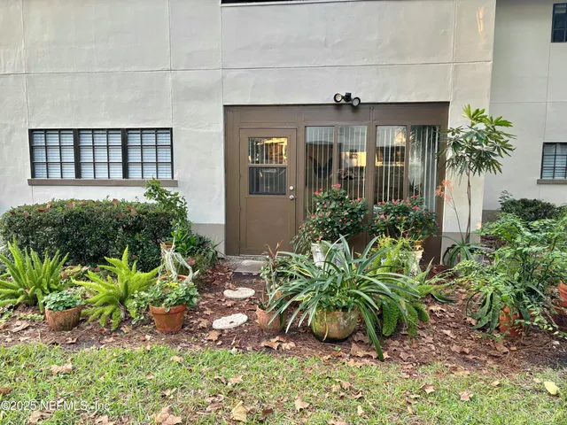 a view of a house with a garden