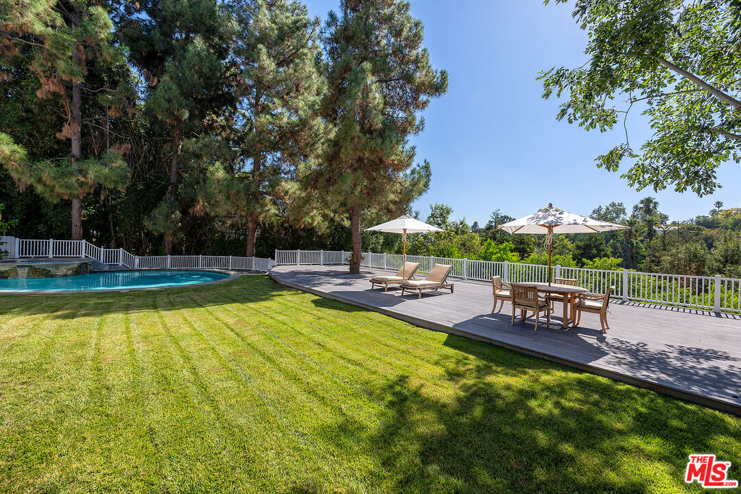 655 North Faring Road Los Angeles, CA 90077 - Photo 17 of 23 a view of a swimming pool with chairs