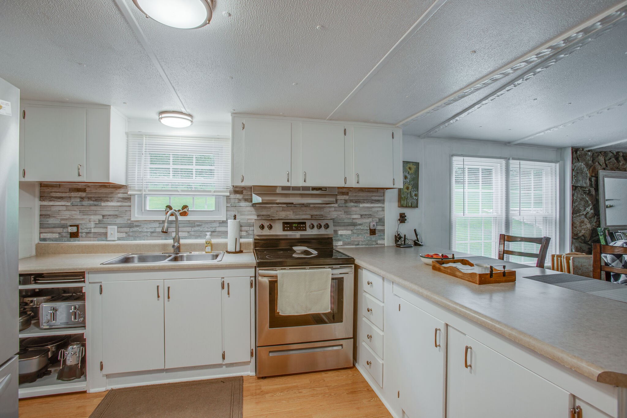 56 Morgan Road Lawrenceburg, TN 38464 - Photo 13 of 30 a kitchen with a sink stove and cabinets