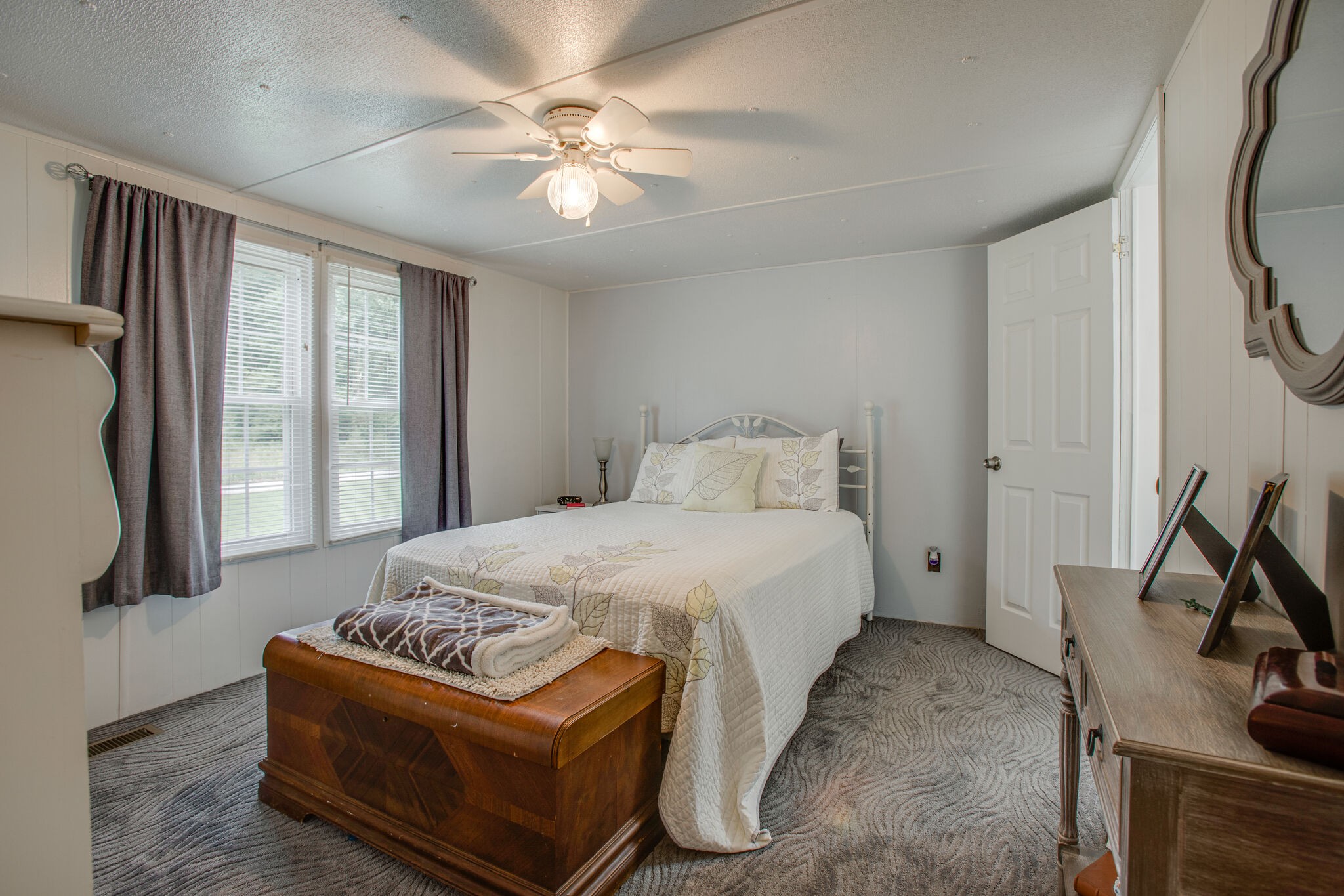 56 Morgan Road Lawrenceburg, TN 38464 - Photo 17 of 30 a bedroom with a bed window and a flat screen tv