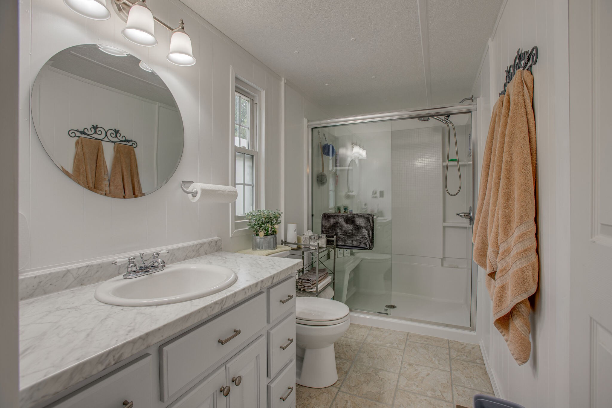 56 Morgan Road Lawrenceburg, TN 38464 - Photo 18 of 30 a bathroom with a granite countertop sink toilet and shower